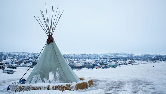 A teepee stands on the side of a hill overlooking in the Oceti Sakowin Camp near the Standing Rock Reservation on Saturday, Dec. 3, 2016 near Cannon Ball.