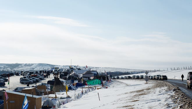 Cars line up to enter the Oceti Sakowin Camp near the Standing Rock Reservation on Saturday, Dec. 3, 2016 near Cannon Ball.