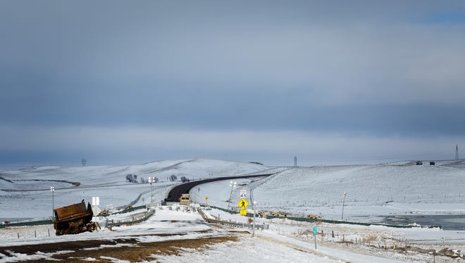 A bridge on North Dakota state highway 1806 sits blocked north of the Oceti Sakowin Camp near the Standing Rock Reservation on Saturday, Dec. 3, 2016 near Cannon Ball.