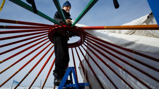 Heinz Brummel from Minneapolis works to construct a yurt paid for through a GoFundMe campaign put on by Indigenous Roots on Saturday, Dec. 3, 2016 near Cannon Ball.