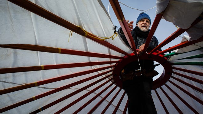 Heinz Brummel from Minneapolis works to construct a yurt paid for through a GoFundMe campaign put on by Indigenous Roots on Saturday, Dec. 3, 2016 near Cannon Ball.