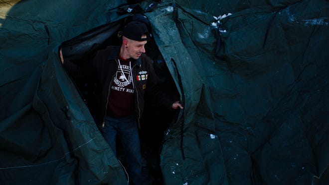 Veteran Derrick Bamden, 33 of San Marcos, helps put up a shelter tent for other veterans in the Oceti Sakowin Camp near the Standing Rock Reservation on Saturday, Dec. 3, 2016 near Cannon Ball.