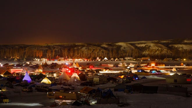 Demonstrators work in the Oceti Sakowin Camp near the Standing Rock Reservation on Saturday, Dec. 3, 2016 near Cannon Ball.