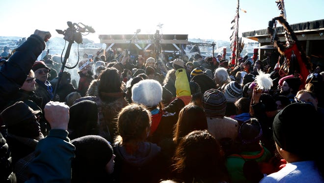 Demonstrators celebrate after the Army Corps of Engineers denied Dakota Access an easement to cross the Missouri River on Sunday, Dec. 4, 2016 near Cannon Ball.
