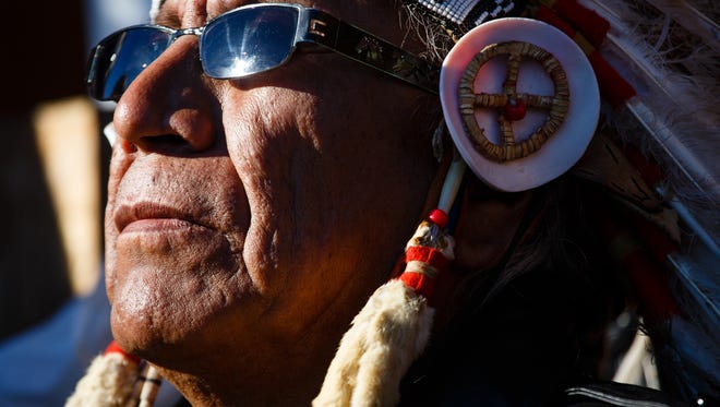 Chief Arvol Looking Horse, listens as speakers address the crowd in the Oceti Sakowin Camp near the Standing Rock Reservation on Sunday, Dec. 4, 2016 near Cannon Ball.