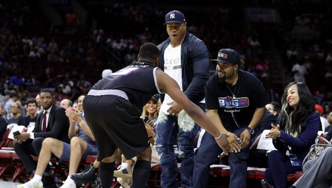 LL Cool J and Big3 founder Ice Cube celebrate with Marcus Banks of the Ghost Ballers after a basket against Power during Week 4.