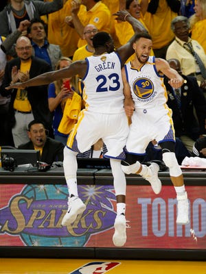 Stephen Curry celebrates with Draymond Green in the fourth quarter of Game 5 of the NBA Finals.