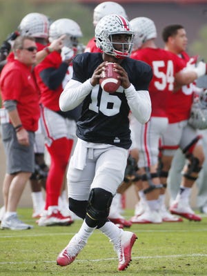 Ohio State quarterback J.T. Barrett (16) practices at Notre Dame Preparatory High School in Scottsdale. Ohio State will play Clemson in the Fiesta Bowl National Semifinal game.