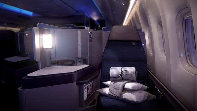 A mock-up of United's new Polaris business class seat shown in nighttime lighting. The seats will first begin flying in early 2017.