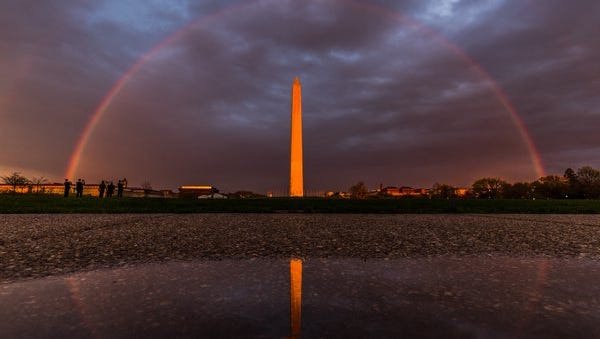 A rainbow frames the Washington Monument in Washington, D.C.