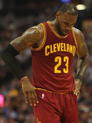 LeBron James reacts during the second half against the Denver Nuggets at Pepsi Center.