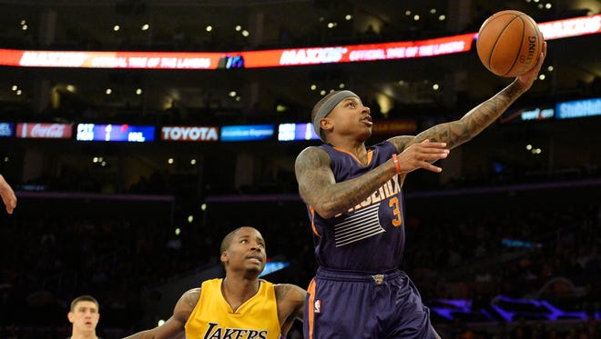 Nov 4, 2014: Phoenix Suns guard Isaiah Thomas (3) drives to the basket against Los Angeles Lakers forward Ed Davis (21) during the first half at Staples Center.