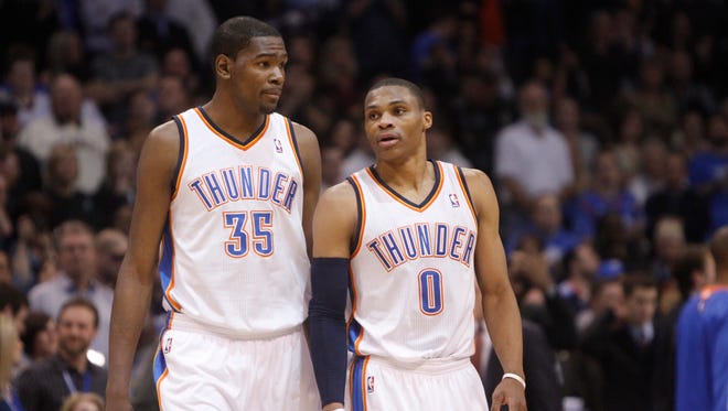 2011: Oklahoma City Thunder forward Kevin Durant and guard Russell Westbrook talk during a game.