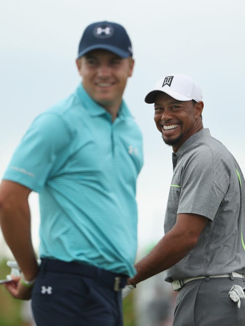 Tiger Woods and Jordan Spieth laugh on the practice range before Round 3 of the Hero World Challenge.