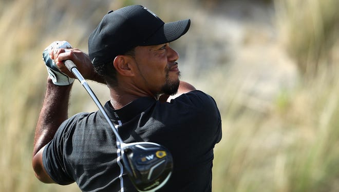 Tiger Woods hits a tee shot on the third hole during Round 1 of the Hero World Challenge.