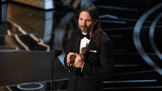 Linus Sandgren accepts the Oscar for Achievement in cinematography for 'La La Land' during the 89th Academy Awards.