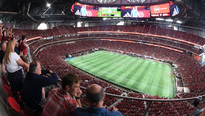 Atlanta United plays Orlando City SC during the second half at Mercedes-Benz Stadium. Atlanta United set an MLS all-time record for highest attendance in a single game with a reported 70,425.