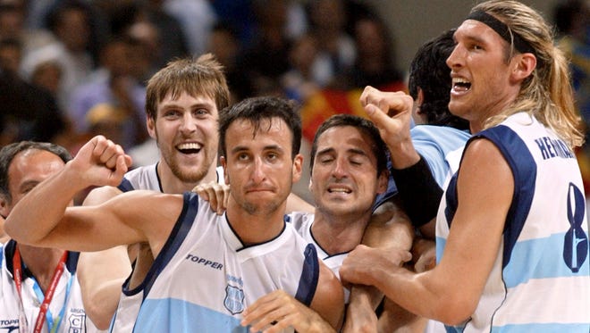 2004: Ginobili celebrates with teammates after beating Team USA 89-81 in their Olympic semifinal match.