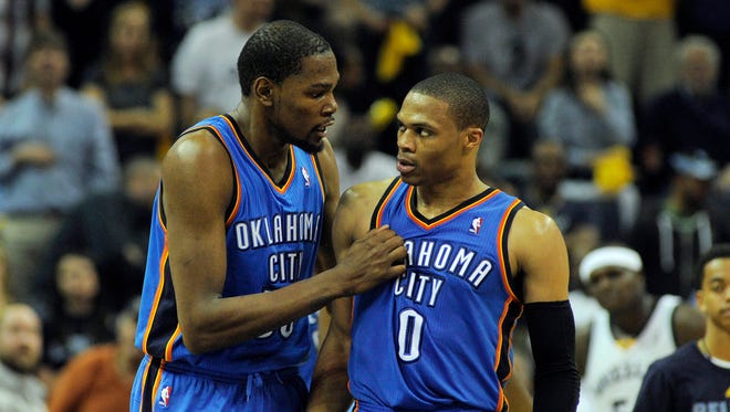 2014: Kevin Durant and Russell Westbrook talk during a game against the Memphis Grizzlies.