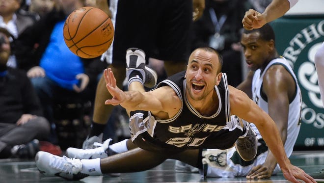 2016: Ginobili reaches for a loose ball in the third quarter during a game against the Milwaukee Bucks.