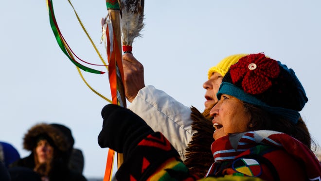 Native elder Beatrice Menasekwe Jackson, 67 of Michigan chants during a daily water ceremony in the Oceti Sakowin Camp near the Standing Rock Reservation on Saturday, Dec. 3, 2016 near Cannon Ball.