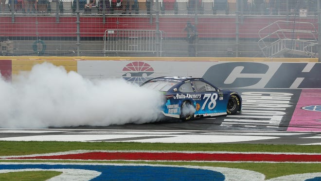 Martin Truex Jr. performs a burnout after winning at Charlotte Motor Speedway on Oct. 8, for his sixth victory of the season and second of the playoffs.
