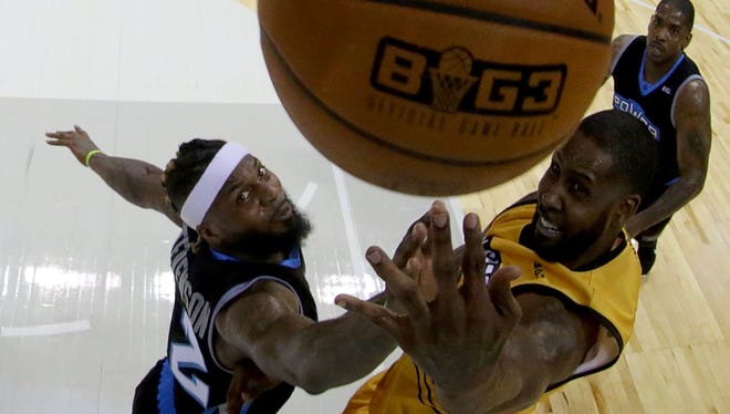 Deshawn Stevenson #92 of Power and Larry Hughes #21 of the Killer 3s compete for a rebound during week two of the BIG3 three on three basketball league at Spectrum Center on July 2, 2017 in Charlotte, North Carolina.