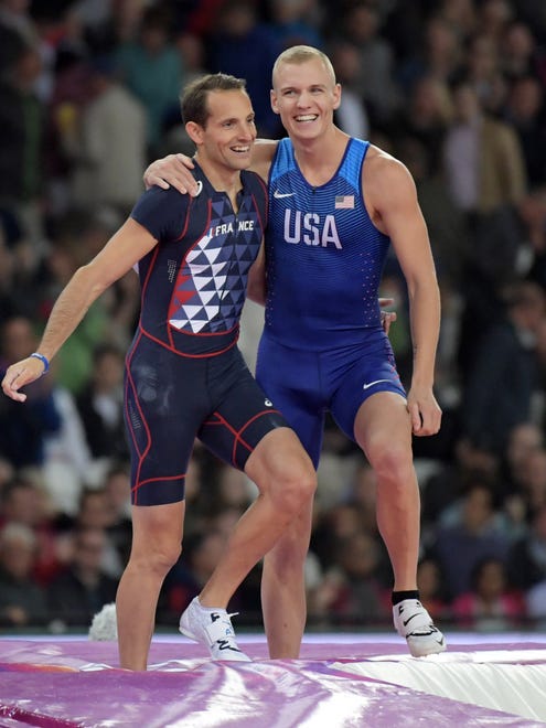 Sam Kendricks of the U.S. and Renaud Lavillenie of France embrace after placing first and third in the pole vault during the IAAF World Championships in Athletics at London Stadium at Queen Elizabeth Park.