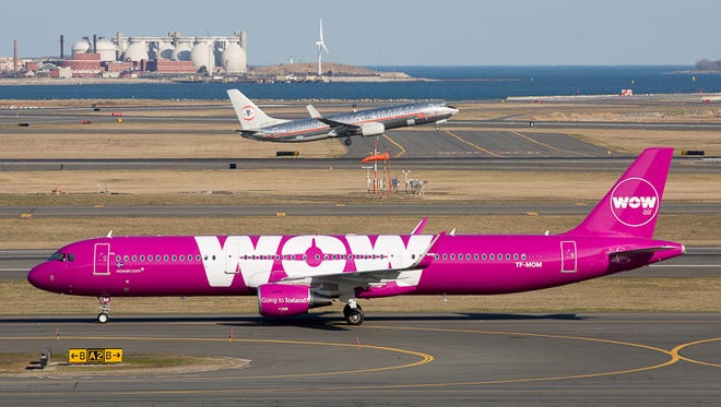 One of Boston's newest visitors, low-cost Icelandic carrier WOW, brightens the airfield with its purplely presence.