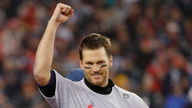 Patriots quarterback Tom Brady (12) celebrates after defeating the Steelers.