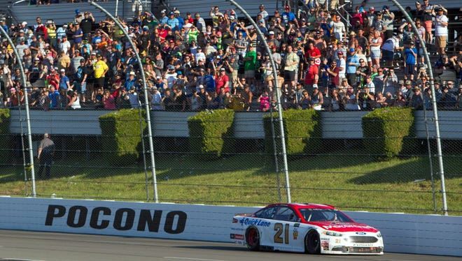 Ryan Blaney celebrates winning the Pocono 400 at Pocono Raceway on June 11 by driving in the opposite direction in front of the grandstand.