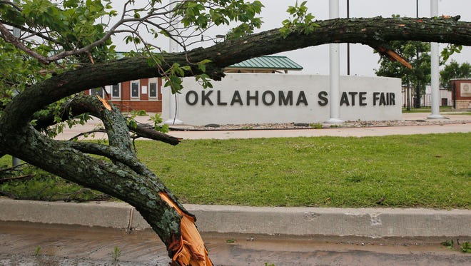 A fallen tree is pictured at the Oklahoma State Fair Park in Oklahoma City on April 29, 2017.
