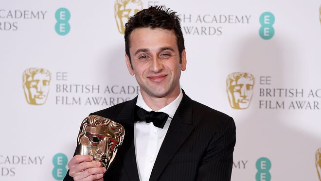 Composer Justin Hurwitz poses in the press room after winning the award for original music for 'La La Land' during the 2017 EE British Academy Film Awards at The Royal Albert Hall in London Feb. 12, 2017.