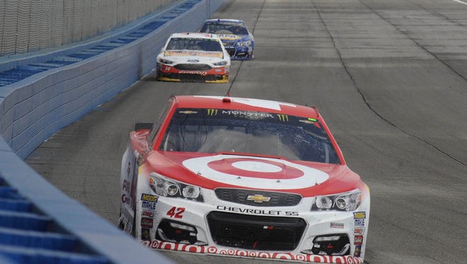 Eventual winner Kyle Larson (42) leads a group during the Auto Club 400 at Fontana's Auto Club Speedway on March 26.