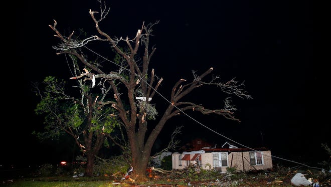 A home missing it's roof and trees that have been stripped bare are seen along State Highway 80 in Fruitvale, Texas, after a tornado swept through late April 29, 2017. Fruitvale is north of Canton. Fatalities have been reported and dozens of people were taken to hospitals after a tornado hit the small city of Canton in East Texas, authorities said.