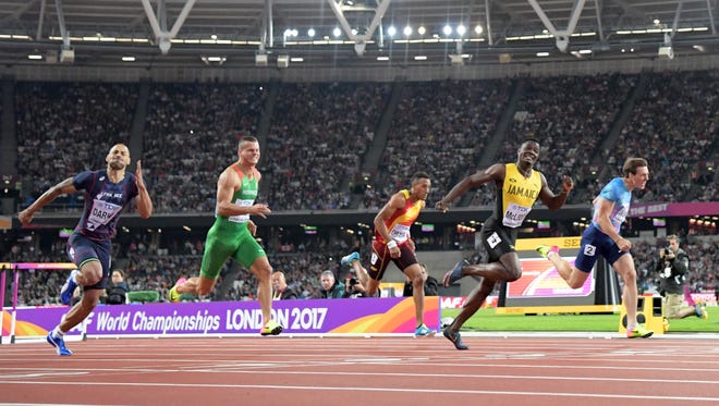 Omar McLeod of Jamaica wins the 110 hurdles ahead of Sergey Shubenkov of Russia (competing independently).