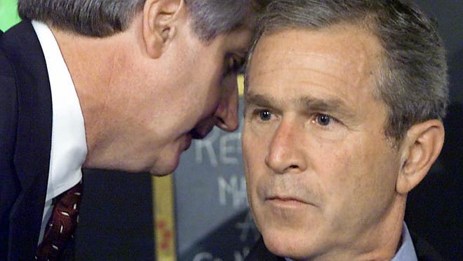 President George W. Bush has his early morning school reading event interrupted by his chief of staff Andrew Card, shortly after the news of a plane hitting one of the World Trade Center buildings in Sarasota, Fla.