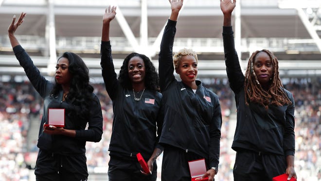 Francena McCorory, Ashley Spencer,  Natasha Hastings and Jessica Beard of the USA pose with their gold medals which they received during the IAAF World Championships in London, after being promoted from second place to first for their performance in the women's 4x400 relay from the 2013 world championships.