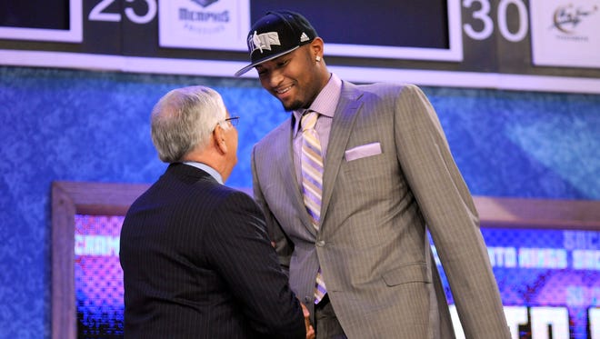 2010: NBA commissioner David Stern, left, shakes hands with Kentucky forward DeMarcus Cousins, who was selected fifth overall by the Sacramento Kings.