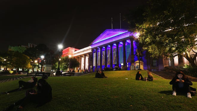 The colors of the Union Jack, the national flag of the United Kingdom, are projected on to the Victoria State Library as a tribute to Manchester Bombing victims on May 23, 2017 in Melbourne, Australia.