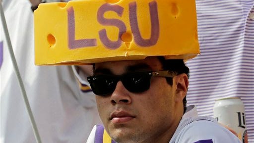 An LSU fan watches from Lameau Field during the first half of an NCAA college football game against Wisconsin Saturday, Sept. 3, 2016, in Green Bay, Wis.