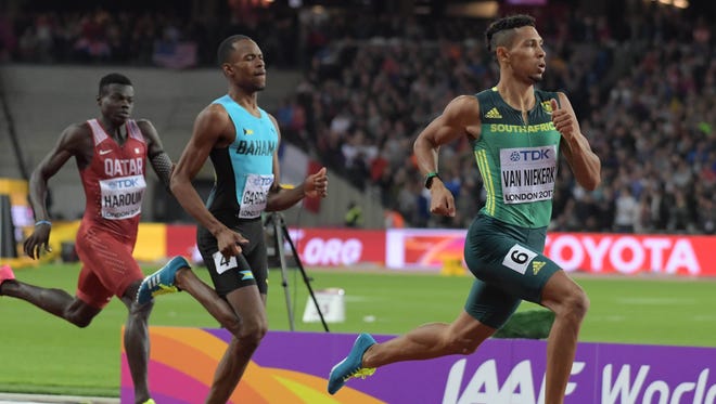 South Africa's Wayde Van Niekerk defeats Steven Gardner of Bahrain to win the 400 meters at the IAAF World Championships in Athletics at London Stadium at Queen Elizabeth Park.