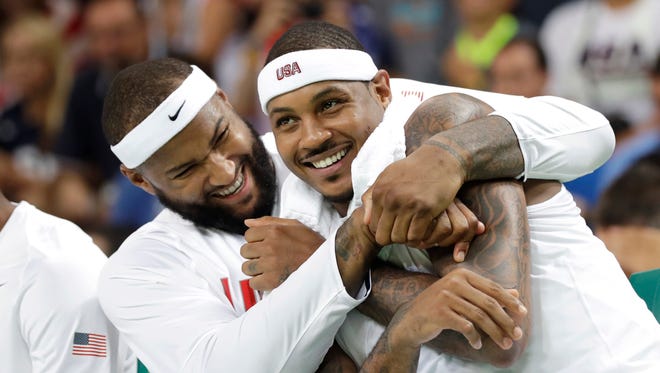 2016: United States' DeMarcus Cousins, left, jokes with teammate United States' Carmelo Anthony, right, during a men's basketball game at the 2016 Summer Olympics.