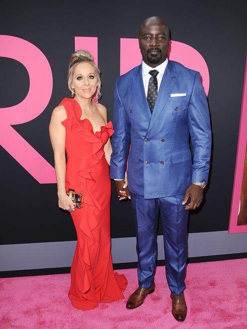 Mike Colter and wife Iva Colter were looking very patriotic in blue and red respectively as they attended the premiere together.