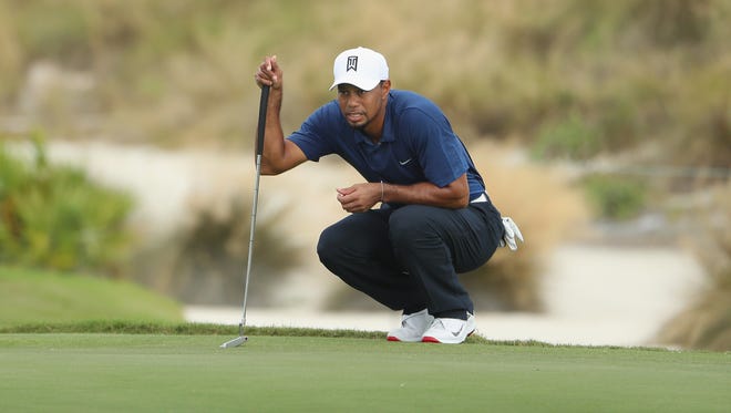 Tiger Woods lines up a putt on the second green during Round 2 of the Hero World Challenge.