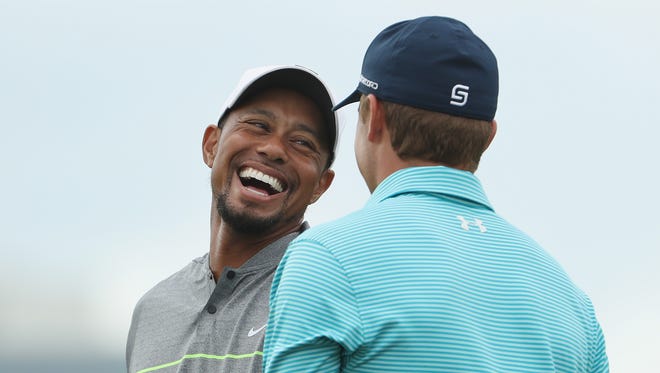 Tiger Woods and Jordan Spieth laugh on the practice range before Round 3 of the Hero World Challenge.