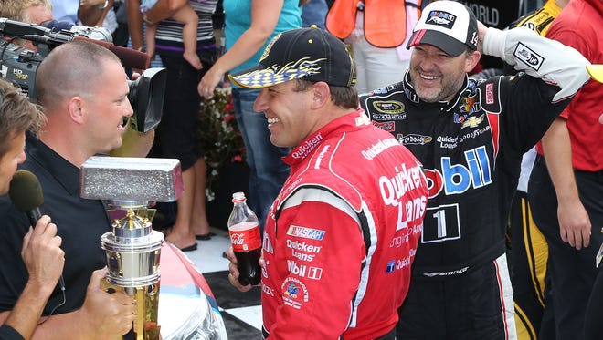 In 2013, Tony Stewart (right) logged a fourth-place finish at the Samuel Deeds 400 at The Brickyard.
