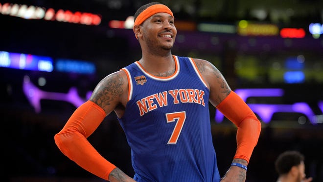 New York Knicks forward Carmelo Anthony reacts during the 118-112 victory against the Los Angeles Lakers at Staples Center.