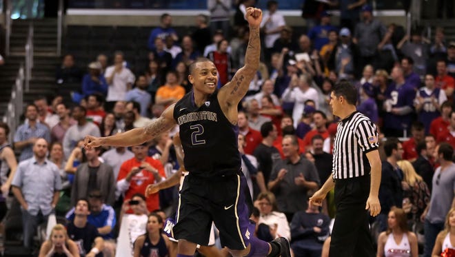 March 12, 2011: Isaiah Thomas of the Washington Huskies reacts as the Arizona Wildcats miss a buzzer shot and the game goes into overtime.