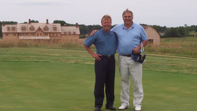 Erin Hills owner Bob Lang (left) poses with Steve Stricker's father-in-law, PGA professional Dennis Tiziani, after Tiziani, Stricker and others were invited to play the fledgling golf course in July 2006.